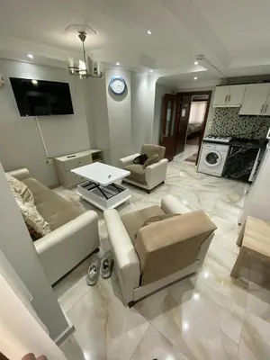 a living room with a couch and a table in it at İsra home 2 in Istanbul