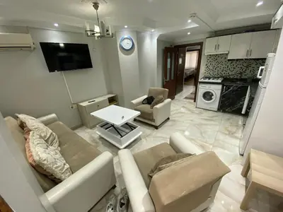a living room with a couch and a table at İsra home 2 in Istanbul