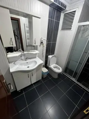 a bathroom with a sink and a toilet at İsra home 2 in Istanbul