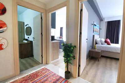 a hallway with a door leading to a bedroom at Excellent Apartments Fatih Golden Horn in Istanbul