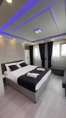 a bedroom with a large bed with a blue ceiling at Özdemir Apart - Sultanahmet in Istanbul