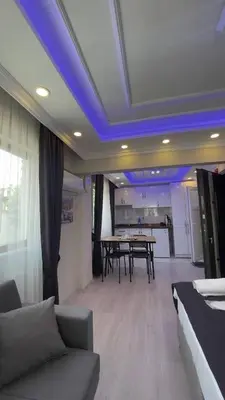 a living room with a table and a blue ceiling at Özdemir Apart - Sultanahmet in Istanbul