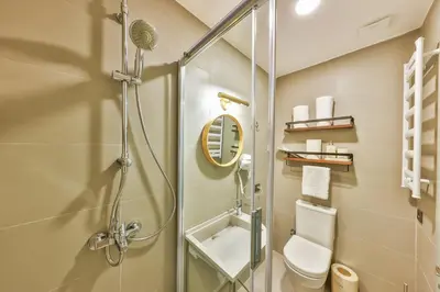 a bathroom with a shower stall and a toilet at Va Mansion in Istanbul