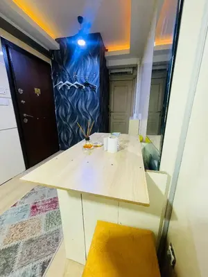 a room with a table and a mirror at Taksim Gold House Hotel in Istanbul