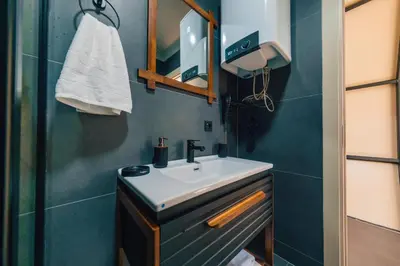 a bathroom with a sink and a mirror at BALİ Sapanca in Sakarya