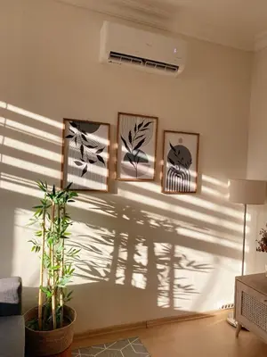 a living room with shadows on the wall at Stylish & Comfort Apartment in Ortaköy in Istanbul