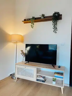 a flat screen tv on a white entertainment center at Stylish & Comfort Apartment in Ortaköy in Istanbul