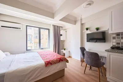 a hotel room with a bed and a television at aymira hotel pangaltı in Istanbul