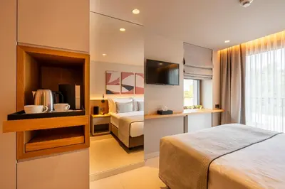 a hotel room with a bed and a television at ERK Hotel in Istanbul