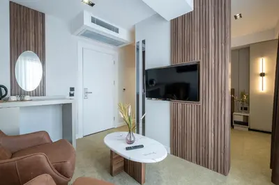 a living room with a couch and a table at Euphrates Hotel Bursa in İhsaniye