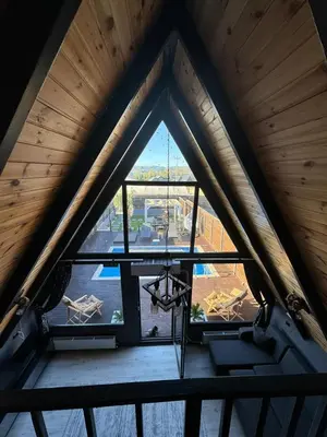 an attic view of a window in a building at Club Armada Bungalow Hotel Sapanca in Sapanca
