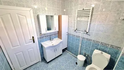 a bathroom with a white toilet and a sink at Close to IST Airport, Sea view& peaceful apartment in Arnavutköy