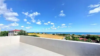a view of the ocean from the balcony of a house at Close to IST Airport, Sea view& peaceful apartment in Arnavutköy
