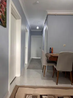 a dining room with a table and chairs at ALTAY Airport SUİT in Tayakadın