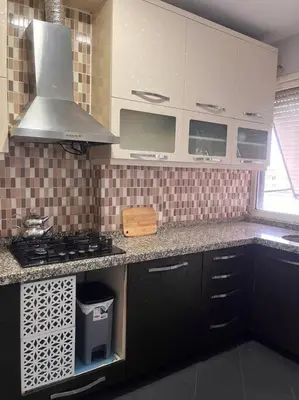 a kitchen with a sink and a stove top oven at Spacious flat with wide view in Istanbul