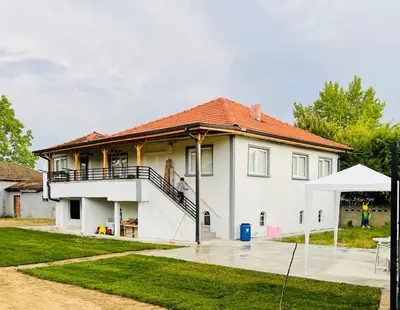 a large white house with a red roof at Farm Village in Sakarya