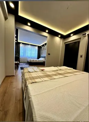 a bedroom with a large bed in a room at The Port Palace Hotel in Istanbul