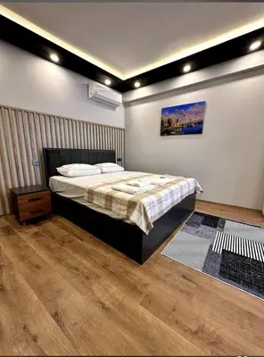 a bedroom with a bed in a room at The Port Palace Hotel in Istanbul