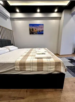 a bedroom with a bed with two towels on it at The Port Palace Hotel in Istanbul