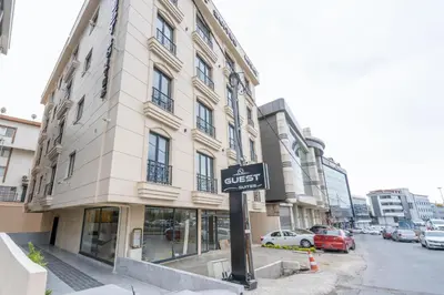 a street sign in front of a building at Guest Suites in Istanbul