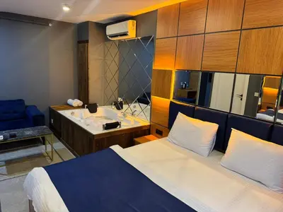 a hotel room with a bed and a sink at Guest Suites in Istanbul