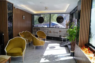 a room with chairs and tables and a window at Sword Suit Hotel in Istanbul