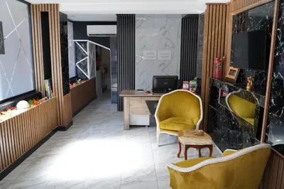 an office with a yellow chair and a desk at Sword Suit Hotel in Istanbul