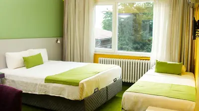 a hotel room with two beds and a window at Mini Harem Hotel in Istanbul