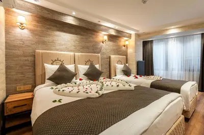 two beds in a hotel room with pillows on them at Old Harbour Hotel istanbul in Istanbul