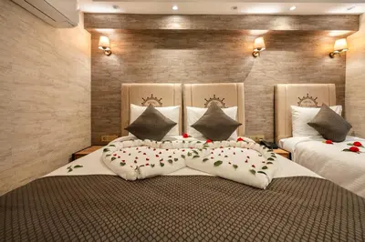 a bedroom with two beds with flowers on them at Old Harbour Hotel istanbul in Istanbul