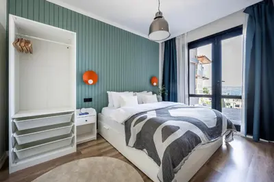 a bedroom with a bed and a green wall at Stay Beyond the Bosphorus #5 in Istanbul
