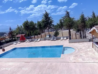 a swimming pool in a villa with a view at Bayramoğlu Suite in Darıca