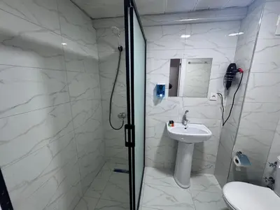 a bathroom with a shower and a sink at Old City Kadıköy Otel in Istanbul