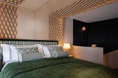 a bedroom with a bed with two pillows on it at Vakko Hotel Sumahan Bosphorus in Istanbul