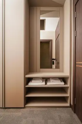 a walk in closet with a mirror and towels at Byon Hotel Şile in Sile