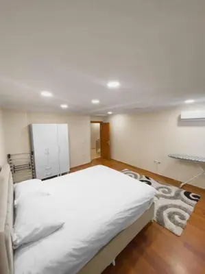 a bedroom with a large white bed in a room at Ground floor apartment in a quiet area 17 in Istanbul