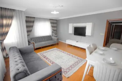 a living room with a couch and a table at Large central apartment in a quiet area 40 in Istanbul