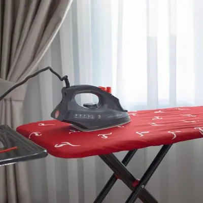 a computer mouse sitting on top of a red table at Large central apartment in a quiet area 40 in Istanbul