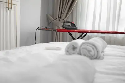 a room with a bed with towels on it at Large central apartment in a quiet area 40 in Istanbul