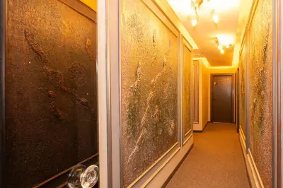 a hallway with a glass door with blood on the walls at White Palace Hotel in Istanbul