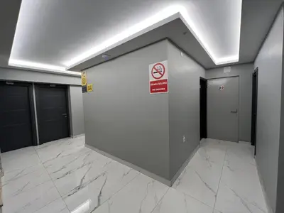 a wall with a no smoking sign in a building at Hotel Prima in Istanbul