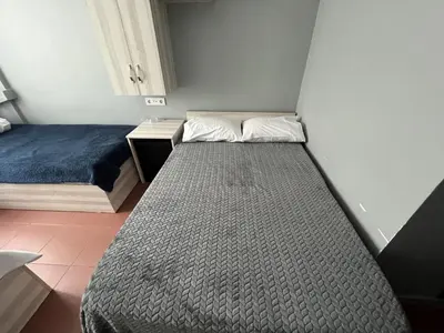 a small bedroom with a bed and a desk at Hotel Prima in Istanbul