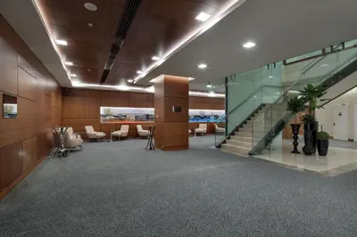 an office with a staircase and a lobby with chairs at Hilton Garden Inn Corlu in Corlu