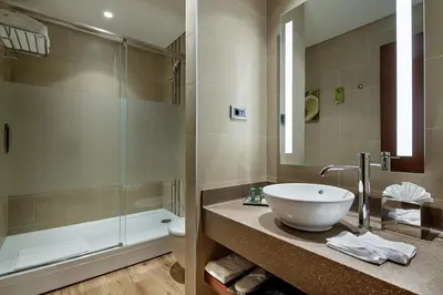 a bathroom with a sink and a shower and a toilet at Hilton Garden Inn Corlu in Corlu