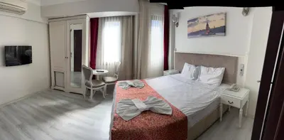 a hotel room with a bed with bows on it at Nacre Boutique Residence in Istanbul