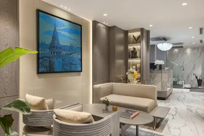 a living room with a table and chairs at Lunet Old City Hotel in Istanbul