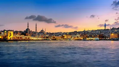 a view of a city from the water at sunset at Lunet Old City Hotel in Istanbul