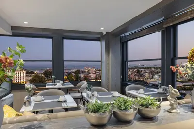 a restaurant with tables and chairs and large windows at Lunet Old City Hotel in Istanbul