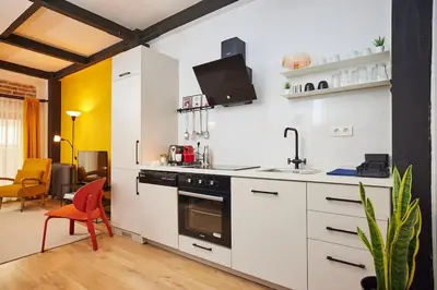 a white kitchen with a sink and a stove at Stunning Apartment at Unbeatable Location in Istanbul