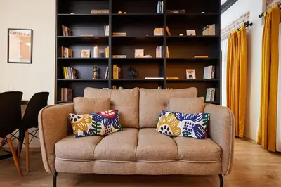 a living room with a couch with two pillows on it at Stunning Apartment at Unbeatable Location in Istanbul